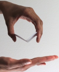By squeezing the opposite edges towards each other, the butterfly pack folds and snaps open